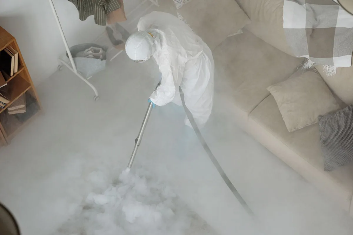 Biohazard cleanup technician in protective equipment, Wilshire Heights, Dallas, TX